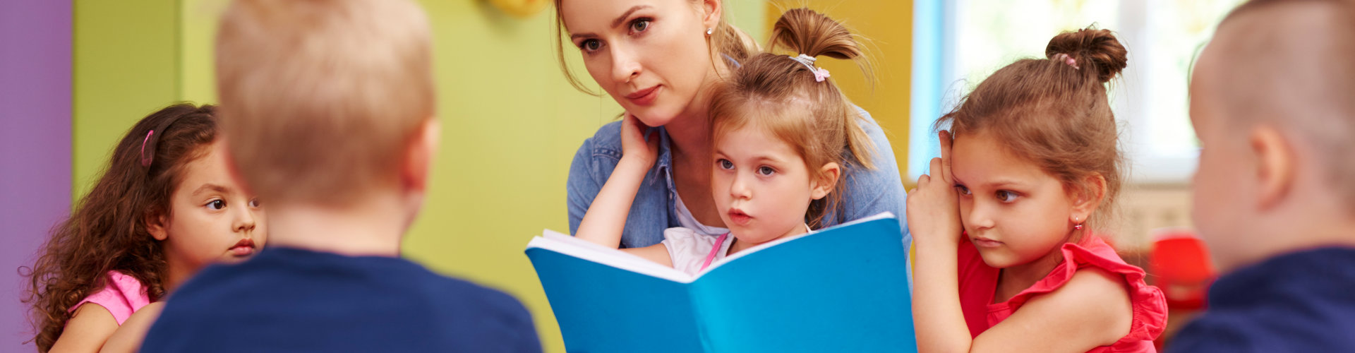Female teacher is reading a book during classes